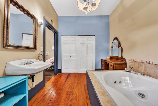 3150 Green Ridge Rd NW, Roanoke, VA 24019 - full bathroom with a tub with jets and hardwood / wood-style floors
