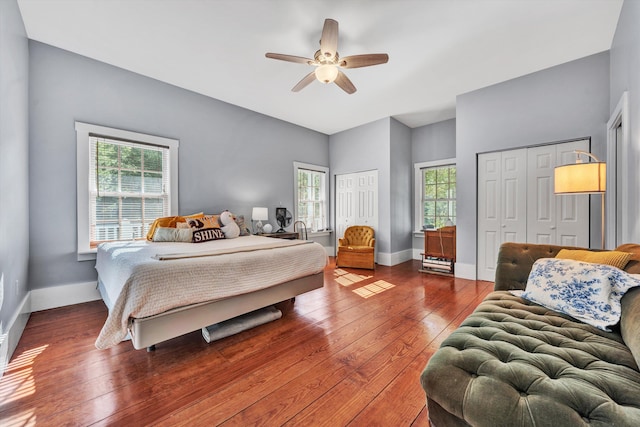 3150 Green Ridge Rd NW, Roanoke, VA 24019 - bedroom with two closets, wood-type flooring, and ceiling fan