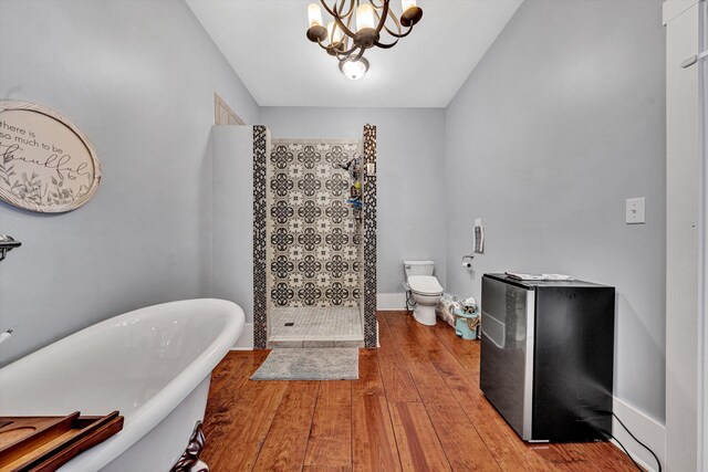 3150 Green Ridge Rd NW, Roanoke, VA 24019 - bathroom featuring walk in shower, a freestanding tub, wood finished floors, and a chandelier