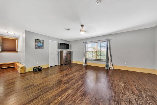 3150 Green Ridge Rd NW, Roanoke, VA 24019 - unfurnished living room featuring wood finished floors and baseboards