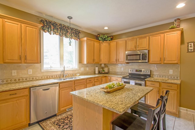 1266 Wills Way, Forest, VA 24551 - kitchen with appliances with stainless steel finishes, a breakfast bar, a kitchen island, light stone countertops, and crown molding