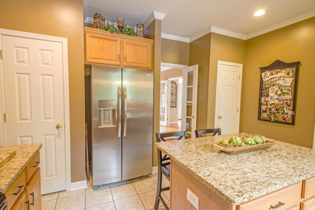 1266 Wills Way, Forest, VA 24551 - kitchen featuring stainless steel fridge, a kitchen breakfast bar, light stone counters, light tile patterned flooring, and light brown cabinetry
