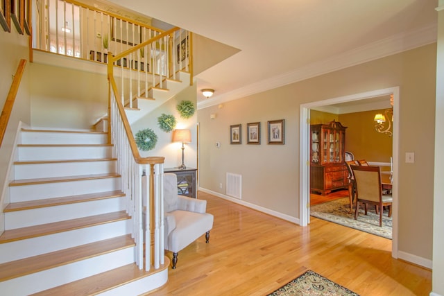 1266 Wills Way, Forest, VA 24551 - staircase with wood finished floors, ornamental molding, and a chandelier