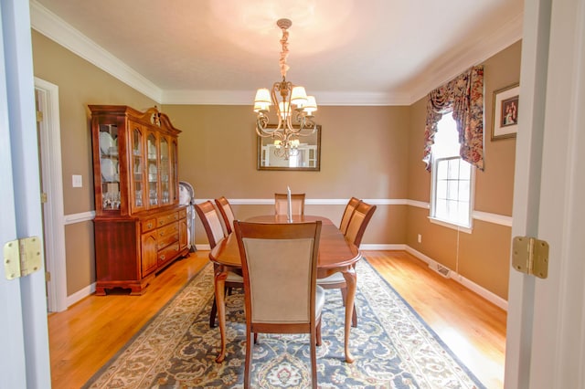 1266 Wills Way, Forest, VA 24551 - dining area featuring a chandelier, light wood-style flooring, and crown molding