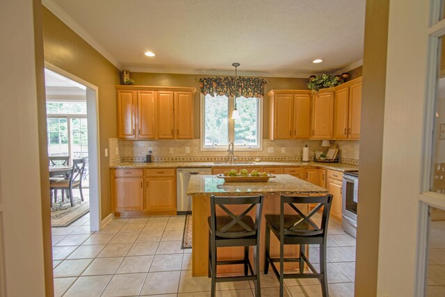 1266 Wills Way, Forest, VA 24551 - kitchen featuring appliances with stainless steel finishes, plenty of natural light, light tile patterned flooring, backsplash, and crown molding