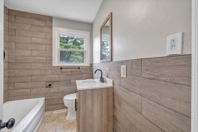 1709 Coveland Dr NW, Roanoke, VA 24017 - bathroom featuring tile walls, a tub to relax in, vanity, and tile patterned flooring