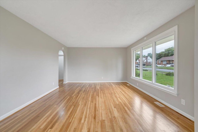 1709 Coveland Dr NW, Roanoke, VA 24017 - unfurnished room featuring light wood finished floors and arched walkways