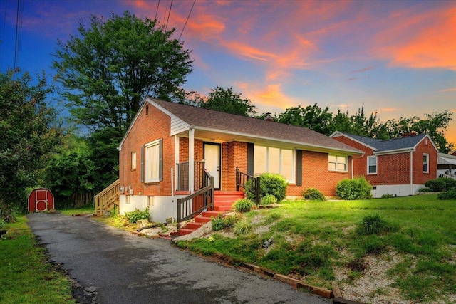 1709 Coveland Dr NW, Roanoke, VA 24017 - ranch-style home featuring brick siding, a shed, and asphalt driveway