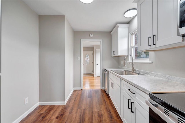 1709 Coveland Dr NW, Roanoke, VA 24017 - kitchen featuring dark wood-style floors, light countertops, white cabinets, and stainless steel dishwasher