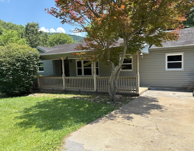 713 Rose Ave, Covington, VA 24426 - view of front of property with a porch, a front yard, and a shingled roof