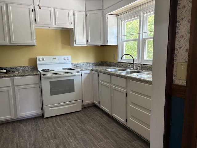 713 Rose Ave, Covington, VA 24426 - kitchen featuring electric stove and white cabinets