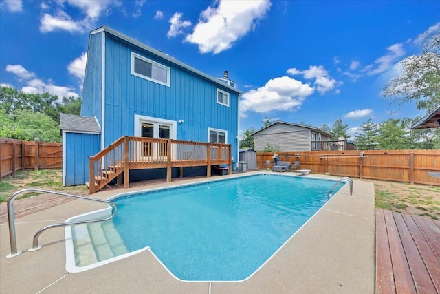 3341 Fort Lewis Cir, Salem, VA 24153 - view of pool with a shed, a wooden deck, a fenced backyard, and a diving board