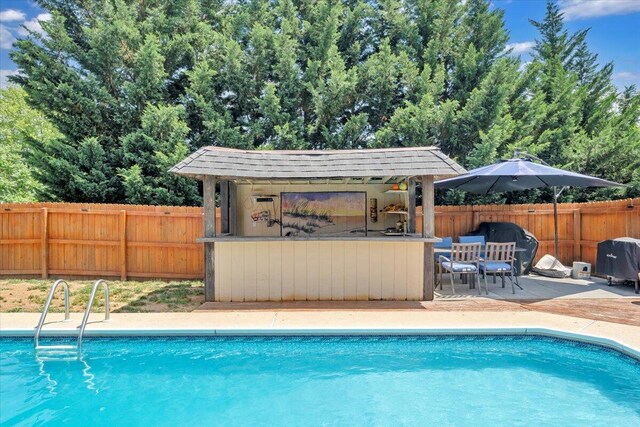 3341 Fort Lewis Cir, Salem, VA 24153 - view of swimming pool with a patio and an outdoor structure