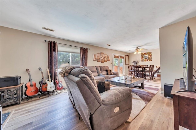 3341 Fort Lewis Cir, Salem, VA 24153 - living room with light wood-style floors and a ceiling fan