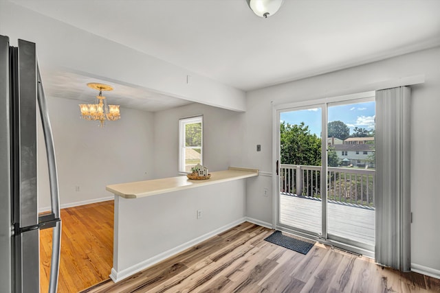3716 Bower Rd, Roanoke, VA 24018 - unfurnished room featuring light wood-style floors and a chandelier