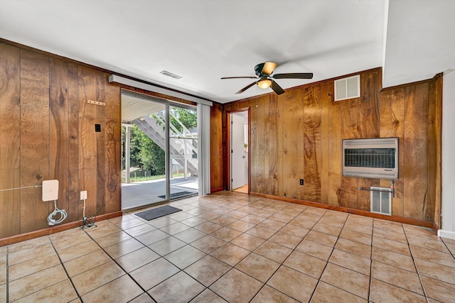 3716 Bower Rd, Roanoke, VA 24018 - unfurnished living room with wooden walls, heating unit, ceiling fan, and light tile patterned floors