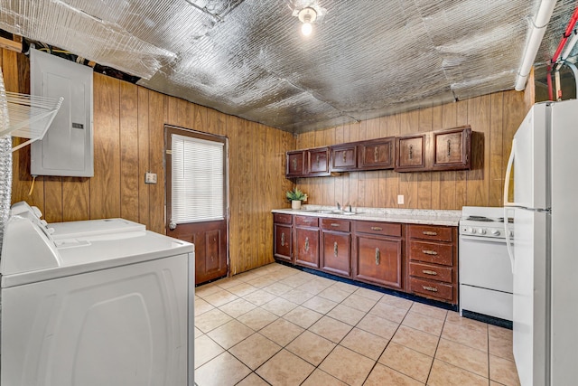 3716 Bower Rd, Roanoke, VA 24018 - kitchen featuring separate washer and dryer, white appliances, electric panel, light countertops, and wood walls