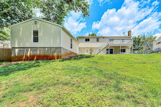 3716 Bower Rd, Roanoke, VA 24018 - back of property with a chimney, stairs, and a wooden deck
