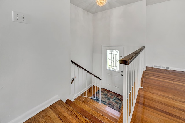 3716 Bower Rd, Roanoke, VA 24018 - stairway featuring wood finished floors and a chandelier