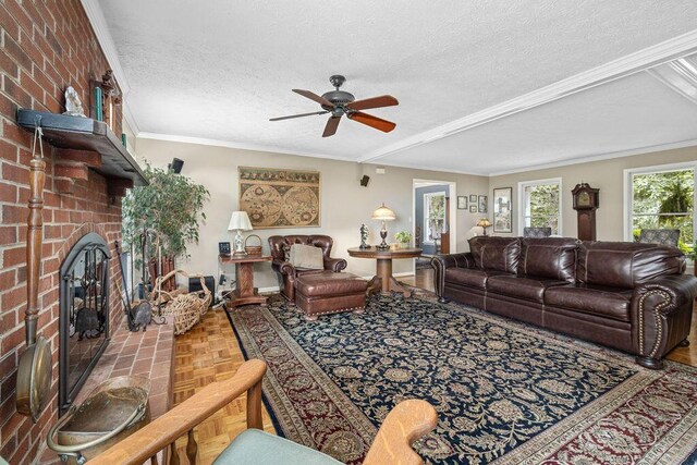 420 Cresthill Rd, Lynchburg, VA 24504 - living room with ceiling fan, a fireplace, a textured ceiling, and crown molding
