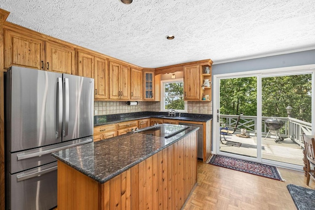 420 Cresthill Rd, Lynchburg, VA 24504 - kitchen with freestanding refrigerator, open shelves, brown cabinetry, a textured ceiling, and decorative backsplash