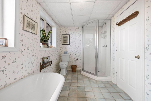 420 Cresthill Rd, Lynchburg, VA 24504 - bathroom featuring a shower stall, a freestanding bath, a drop ceiling, tile patterned flooring, and wallpapered walls