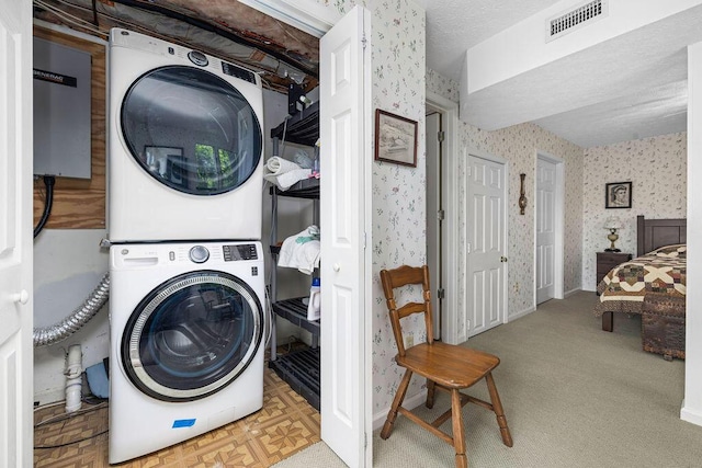 420 Cresthill Rd, Lynchburg, VA 24504 - laundry room featuring stacked washing machine and dryer and wallpapered walls