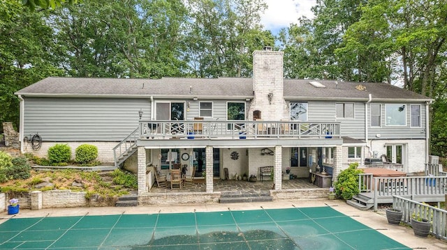 420 Cresthill Rd, Lynchburg, VA 24504 - back of property with a deck, stairs, a chimney, and a patio
