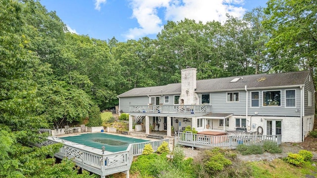 420 Cresthill Rd, Lynchburg, VA 24504 - back of house featuring a deck, a chimney, a covered pool, and a patio