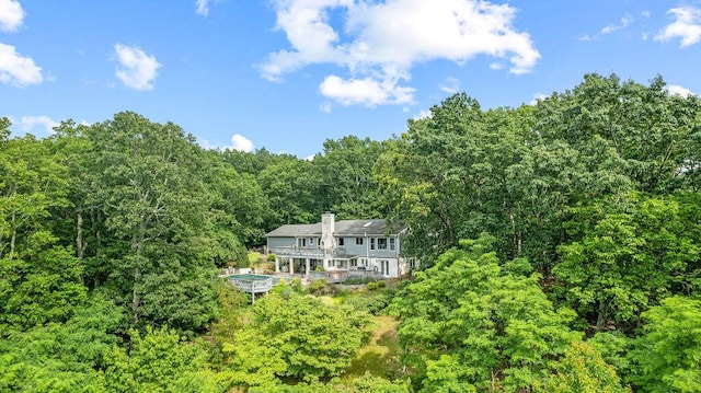 420 Cresthill Rd, Lynchburg, VA 24504 - back of house featuring a forest view, a chimney, and a wooden deck