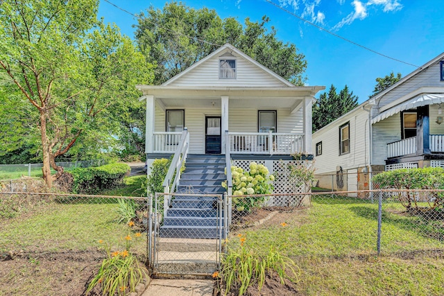 1521 Church Ave SE, Roanoke, VA 24013 - shotgun-style home featuring a porch, stairs, a gate, and a fenced backyard