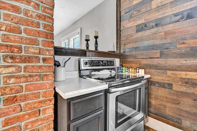 1521 Church Ave SE, Roanoke, VA 24013 - kitchen featuring electric stove, wooden walls, and light countertops