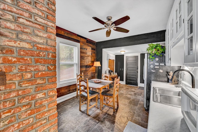 1521 Church Ave SE, Roanoke, VA 24013 - dining space featuring ceiling fan, wood walls, and a baseboard radiator