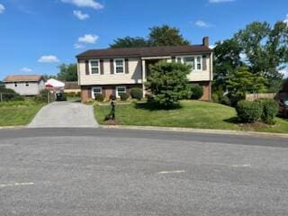 546 Missimer Cir, Vinton, VA 24179 - raised ranch featuring a front lawn, a chimney, and driveway
