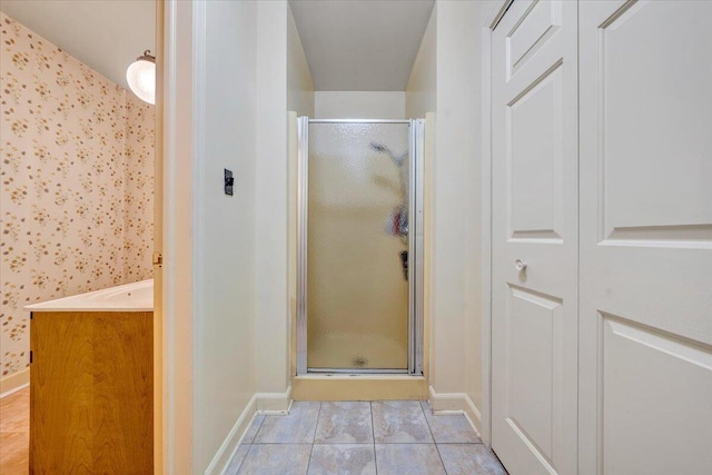 404 Robin Ridge Rd, Rocky Mount, VA 24151 - bathroom featuring a shower stall, vanity, tile patterned flooring, and a closet