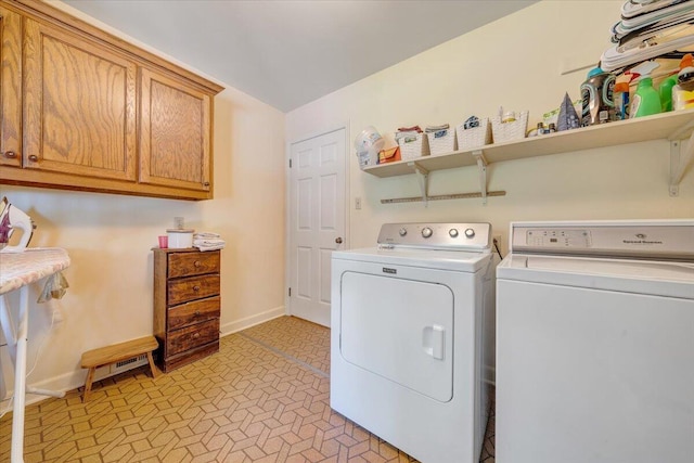 404 Robin Ridge Rd, Rocky Mount, VA 24151 - laundry area featuring independent washer and dryer, cabinet space, and light flooring