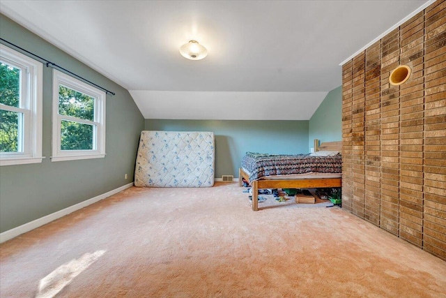 404 Robin Ridge Rd, Rocky Mount, VA 24151 - carpeted bedroom featuring vaulted ceiling and brick wall