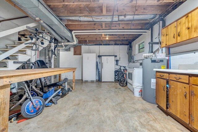 404 Robin Ridge Rd, Rocky Mount, VA 24151 - below grade area featuring water heater, washer / clothes dryer, and freestanding refrigerator