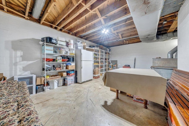 404 Robin Ridge Rd, Rocky Mount, VA 24151 - unfinished basement featuring freestanding refrigerator and a wood stove