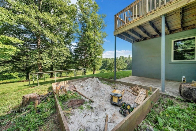 404 Robin Ridge Rd, Rocky Mount, VA 24151 - view of green lawn featuring an outdoor fire pit, a deck, and a patio