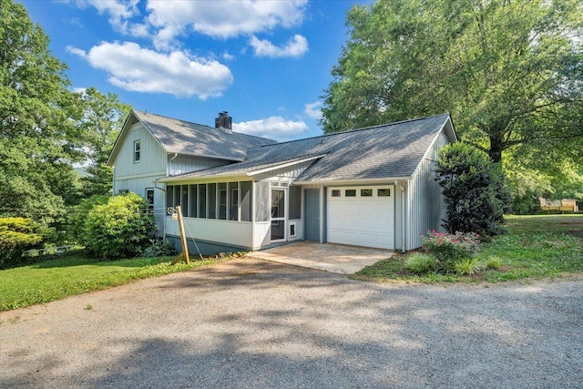 404 Robin Ridge Rd, Rocky Mount, VA 24151 - view of front of home with an attached garage, a chimney, driveway, and roof with shingles