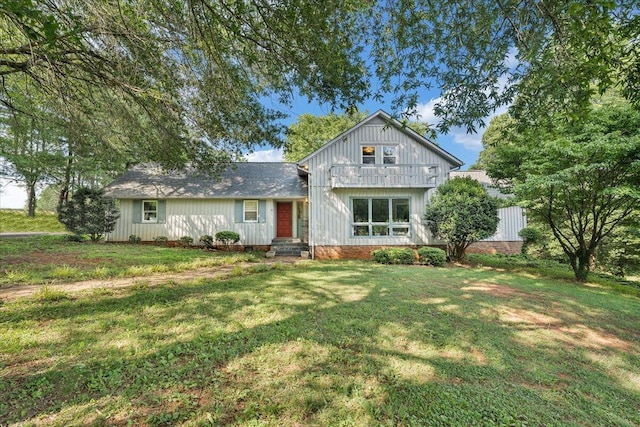 404 Robin Ridge Rd, Rocky Mount, VA 24151 - view of front of property featuring a front lawn, a shingled roof, and board and batten siding