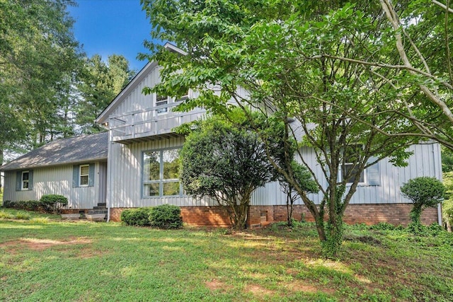 404 Robin Ridge Rd, Rocky Mount, VA 24151 - view of side of property with a lawn, crawl space, board and batten siding, and roof with shingles