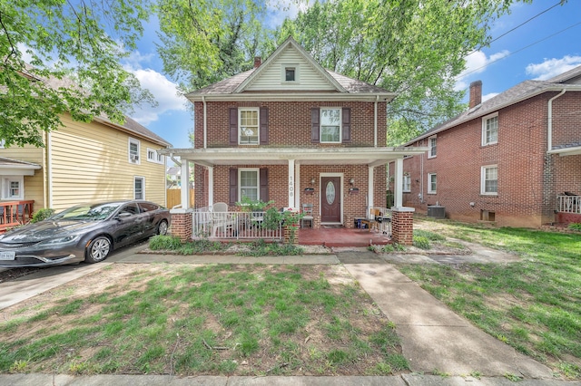 1406 Melrose Ave NW, Roanoke, VA 24017 - american foursquare style home featuring covered porch, brick siding, a front lawn, and a chimney