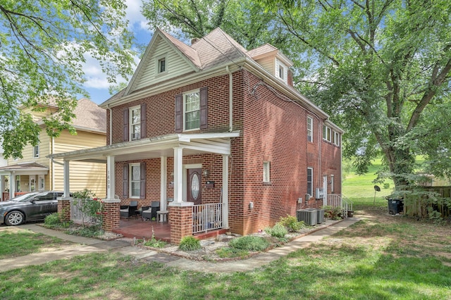 1406 Melrose Ave NW, Roanoke, VA 24017 - traditional style home featuring a porch, brick siding, and a front yard