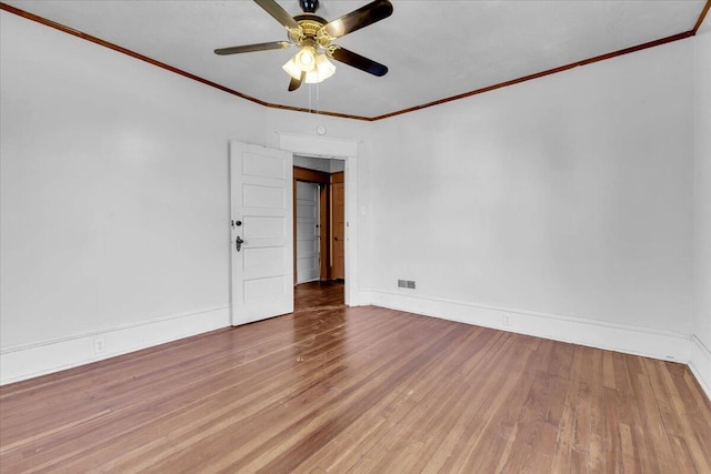 610 18th St SE, Roanoke, VA 24013 - empty room with wood finished floors, ceiling fan, and crown molding