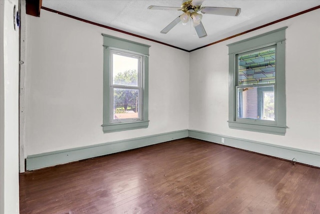 610 18th St SE, Roanoke, VA 24013 - spare room featuring crown molding, dark wood-style flooring, and a ceiling fan