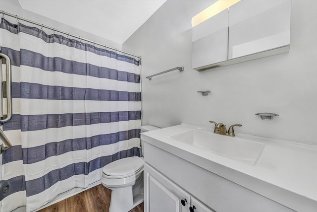 112 Harrison Ave NW, Roanoke, VA 24016 - full bathroom featuring vanity, wood finished floors, lofted ceiling, and a shower with shower curtain