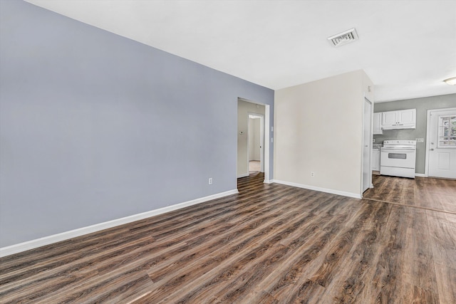 112 Harrison Ave NW, Roanoke, VA 24016 - unfurnished living room with dark wood-style floors and baseboards