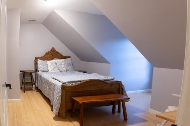 115 Armistead Ln, Rustburg, VA 24588 - bedroom featuring light wood finished floors and lofted ceiling